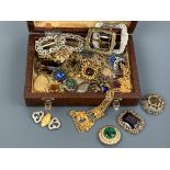 A vintage jewellery box containing a quantity of vintage costume jewellery, predominantly paste