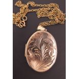 A 9ct gold statement locket on a yellow-metal belcher-link neck chain, chain tested as gold, the