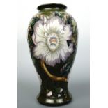 A contemporary Moorcroft vase, of inverted baluster form with flared foot and neck, decorated in the