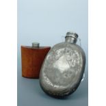 A Victorian Britannia metal hip flask together with one further leather example