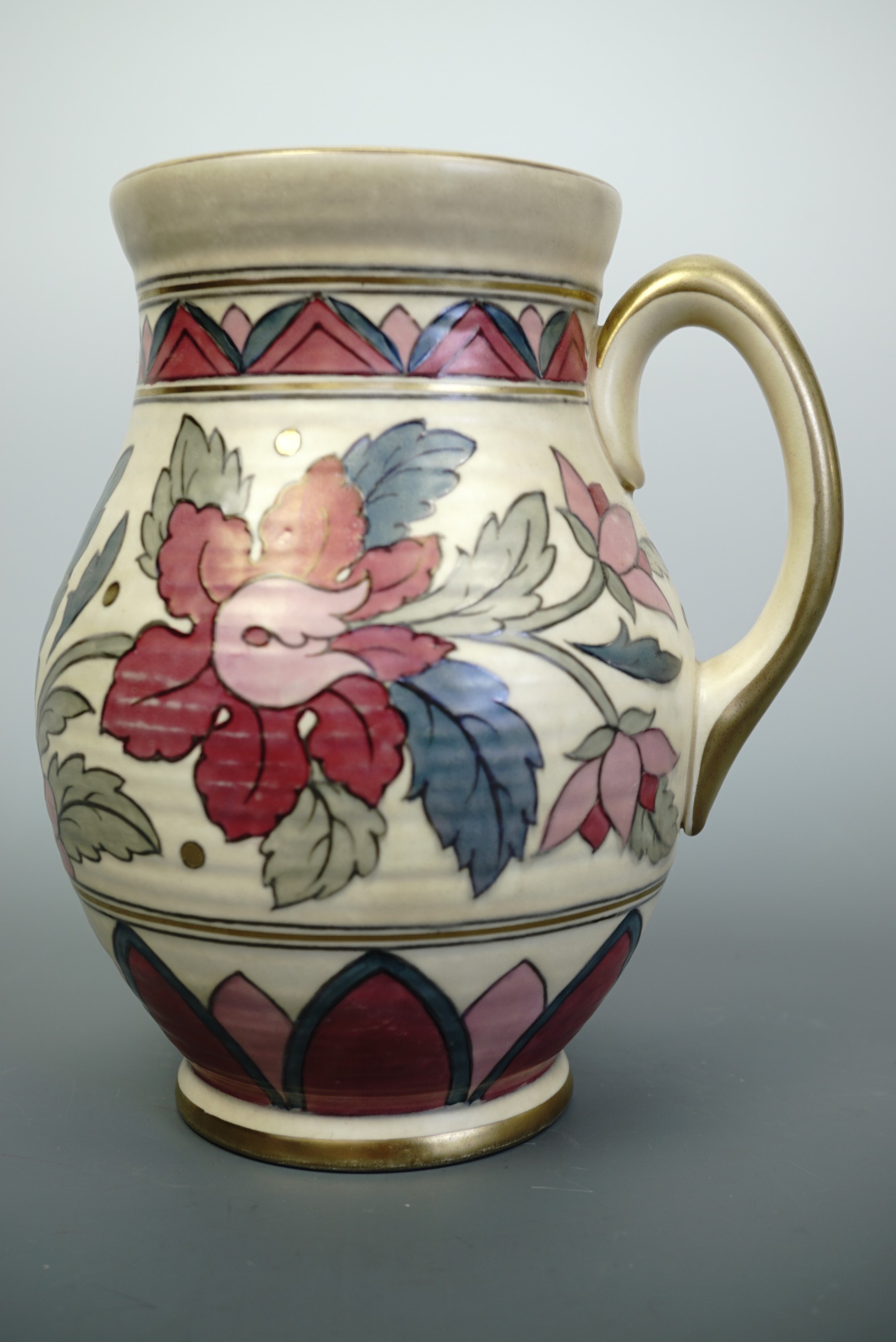 A Charlotte Rhead for Crown Ducal Ankara pattern flower jug, decorated in tones of pink, rose, green