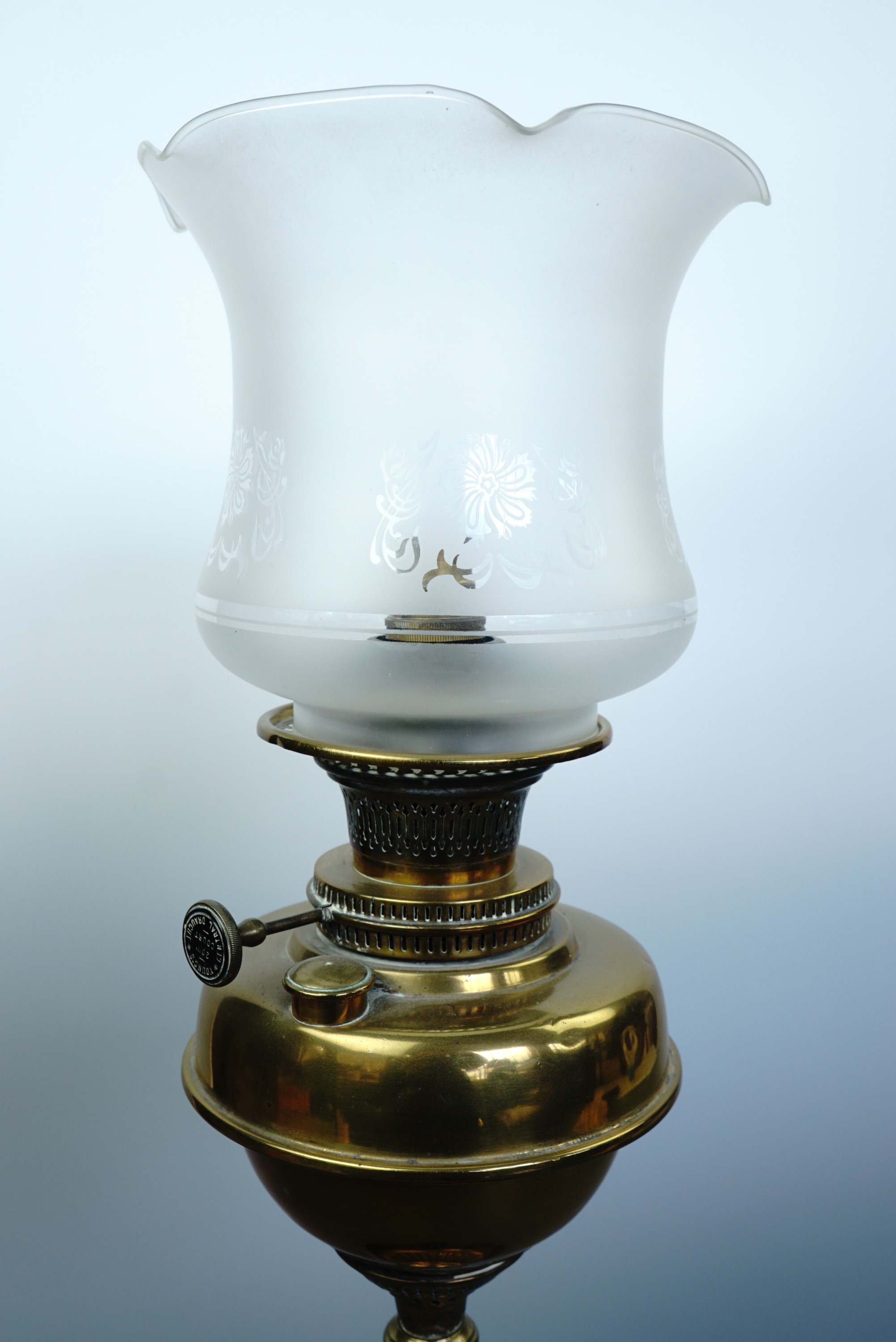 A Victorian brass and black ceramic oil lamp with later etched shade (converted) - Image 2 of 2