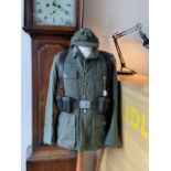 A replica Second World War German army tunic, cap and kit