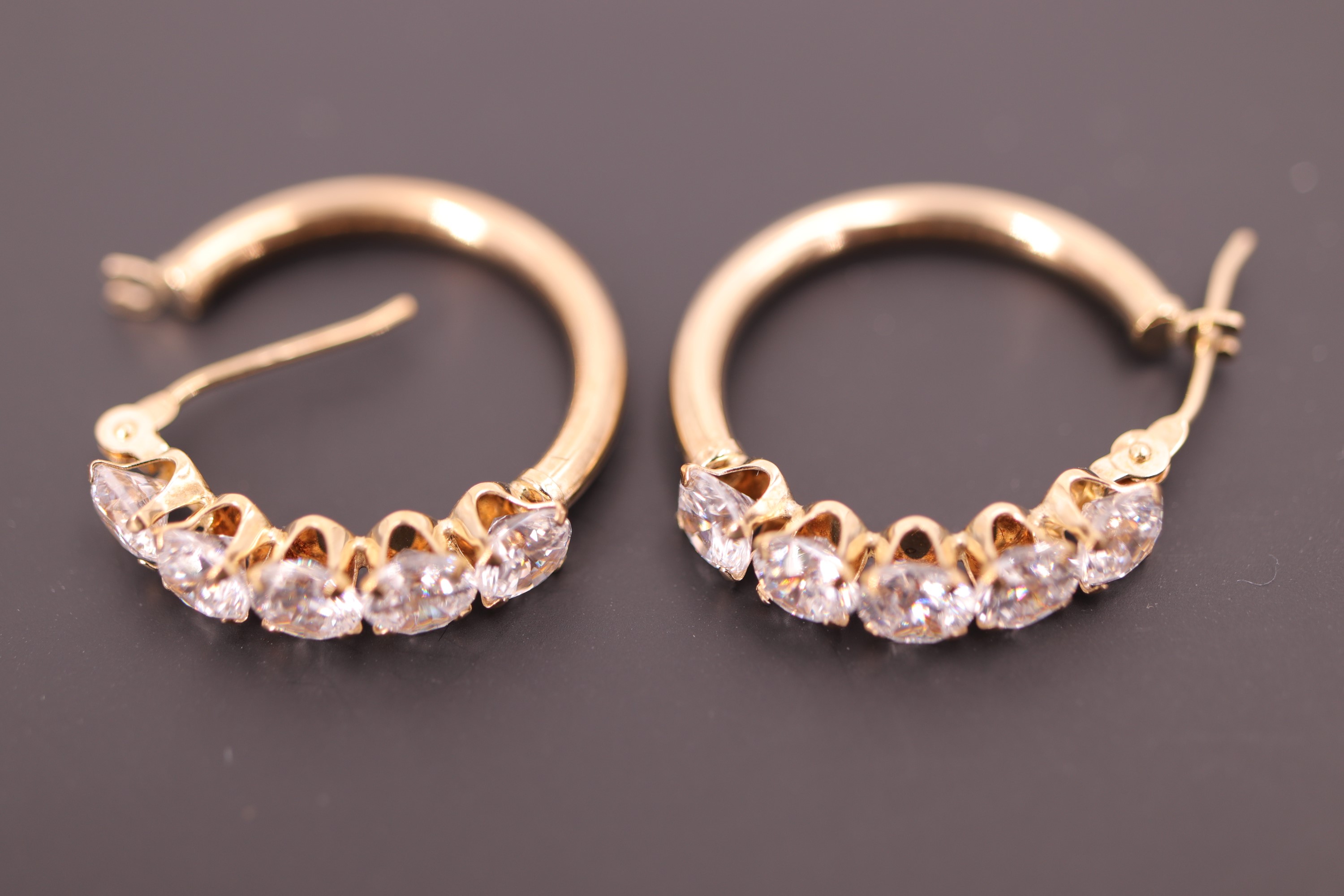 A pair of yellow metal (tested as gold) and goshenite half-hoop earrings, stamped 9K, 1.8 g - Image 2 of 2