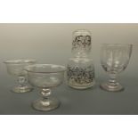 A Victorian glass rummer, a pair of Victorian etched glass coupes or ice glasses and a gilt enriched