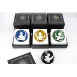 Four boxed Baccarat paperweights from "The Royal Cameos in Crystal" series, including Queen