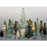 A large collection of 19th Century glass advertising and other bottles and stone ginger beers,