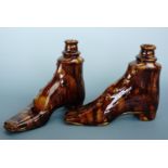 A pair of Victorian treacle-glazed earthenware novelty flasks modelled as gentlemen's boots, (one