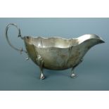 A George V silver cream jug, of helmet form with pinched decoration, Alexander Clark & Co Ltd,