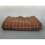 An antique wool plaid throw, approximately 340 x 140 cm, (Condition: signs of darning repairs and