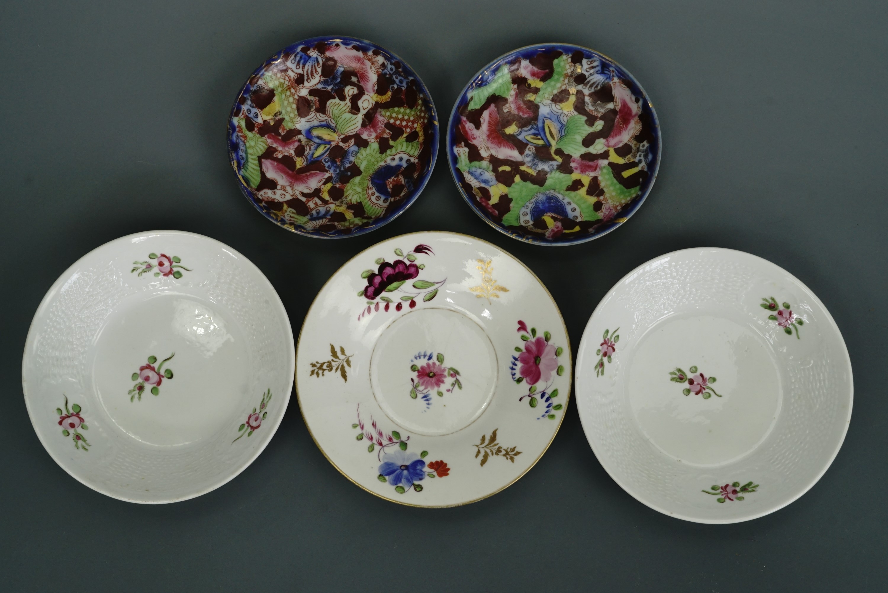 Three 19th Century hand-enamelled porcelain saucers attributed to New Hall, together with two