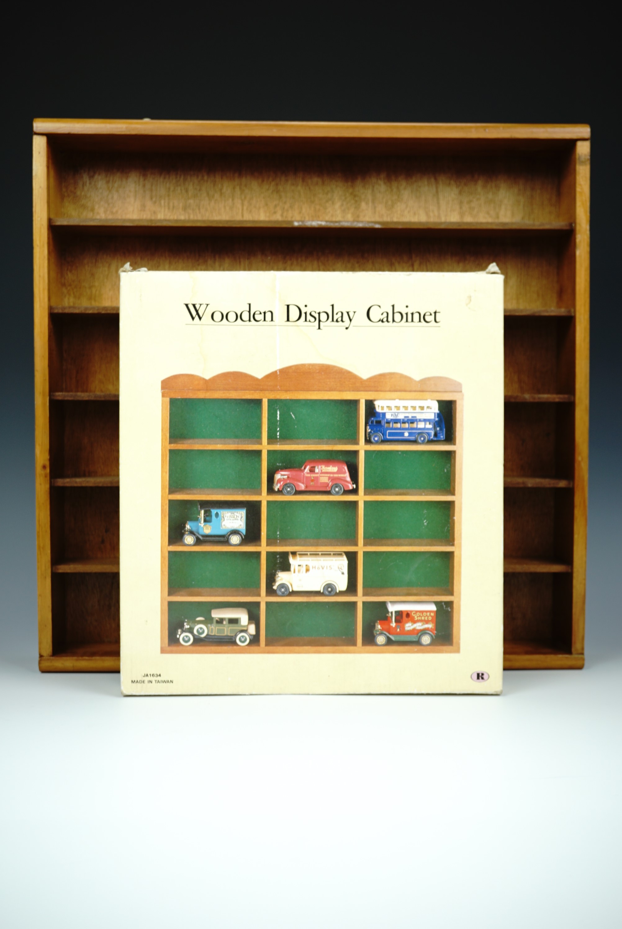 A collection of Corgi and other die-cast collectors cars together with two wooden display