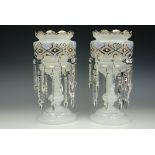A pair of Victorian enamelled and gilt milk glass lustres with pendant prismatic drops, 36 cm