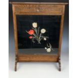 A George V oak fire screen with floral embroidered insert, 64 cm x 22 cm