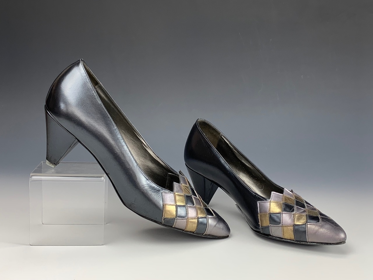 A 1980s pair of Mary Quant court shoes, in navy blue with a metallic diaper pattern toe, - Image 2 of 2