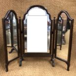 A 1920s Queen Anne influenced mahogany triptych swivel toilet mirror, 65 cm high