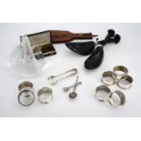 A pair of vintage shoe keepers, a glass lens, electroplate napkin rings etc