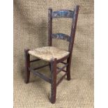 A 19th Century rustic painted and rush-seated standard chair, 79 cm