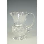 A small Edinburgh Crystal cut glass thistle-form jug, 10 cm