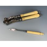 Victorian Ivorine-handled electroplate nut crackers together with a nut pick