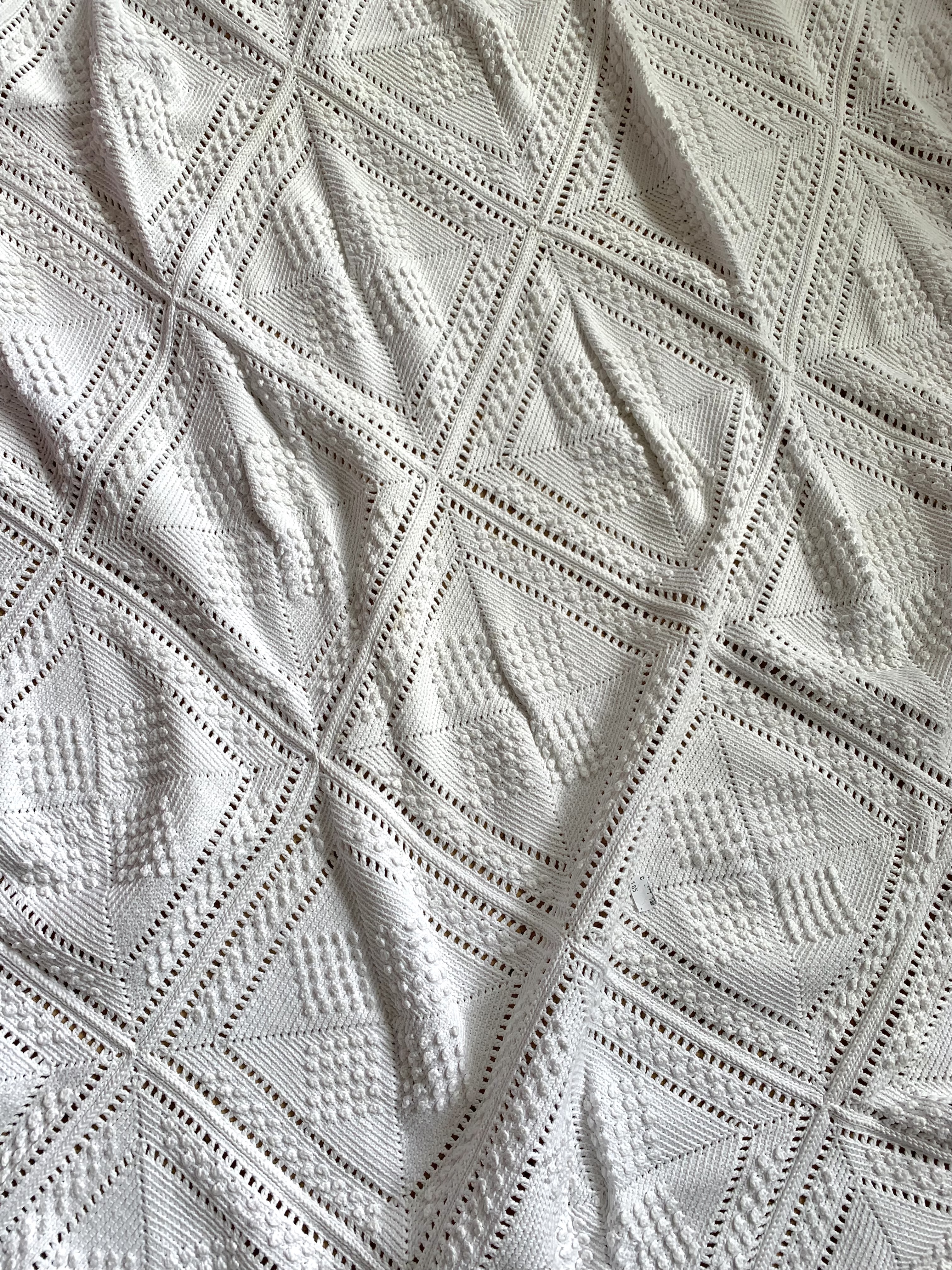 An antique heavy knitted cotton bed spread, worked in a geometric design - Image 4 of 6