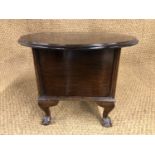 A 1920s mahogany sewing box, having short cabriole legs with ball-and-claw feet