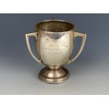 A 1930s silver three-handled oviform trophy cup, engraved "Haft Kell Club, Replica, Open Tennis