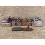 A quantity of antique woodworking moulding planes / tools
