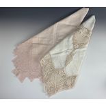 Two Belle Epoque pink tea table cloths, one having a geometric lace trim, drawn-thread work and