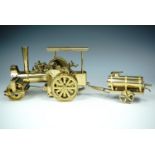 A Wilesco "Old Smoky" live steam model road roller and water bowser