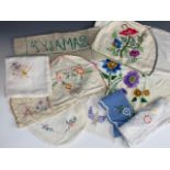 Vintage hand-embroidered domestic linens, including a crewel work tea cosy and cloth, tea table