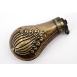 A Victorian copper pistol powder flask, decorated with an embossed anthemion device, 9.5 cm