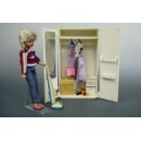 A vintage Sindy doll, wardrobe, house etc