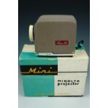 A 1960s Minolta Mini Projector, cased and boxed