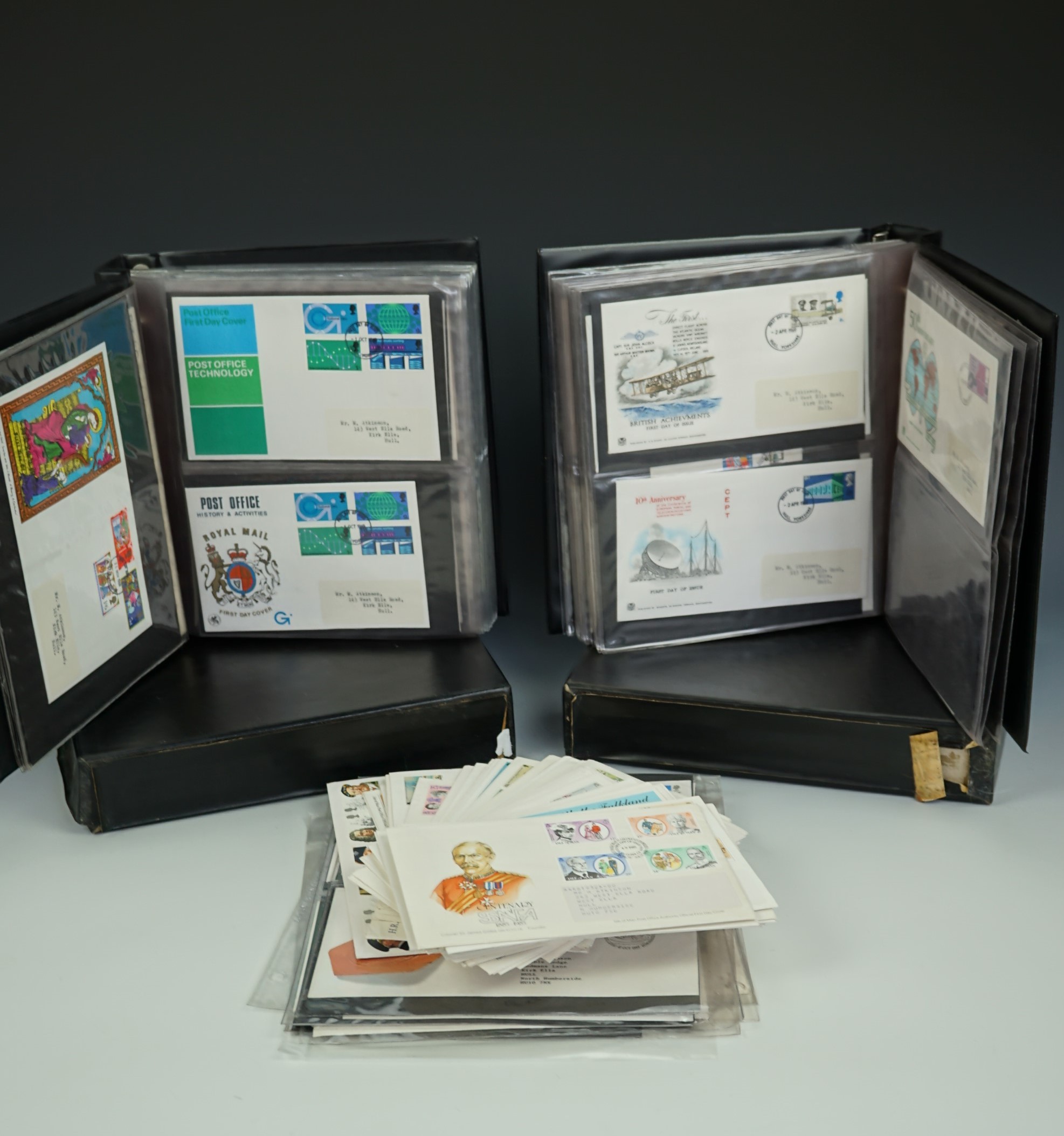 Two Stanley Gibbons folders of largely QEII pre-decimal first day stamp covers, together with
