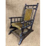 A late 19th Century child's American sprung rocking chair, 64 cm