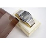 An early 1980s Casio M-321 Melody musical quartz digital wristwatch, in original case with