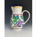 A Poole hand painted floral pattern jug, 18 cm