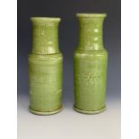 A pair of green crackle-glazed earthenware roulleau-form vases, 30 cm