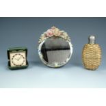 A small Barbolla type dressing table mirror, a Victorian rattan bound hip flask and a Junghans Divox