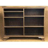 A mahogany open-fronted bookcase, having adjustable wooden shelves and ogee bracket feet, 100 cm x