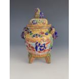 A Japanese moriage enamelled earthenware covered jar, 15 cm
