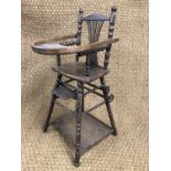 An old reproduction 19th Century child's metamorphic feeding chair