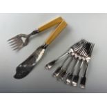 A Victorian set of electroplate fish servers and a set of six fiddle pattern table forks, latter