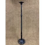 A late 19th / early 20th Century turned and ebonised wig or hat display stand