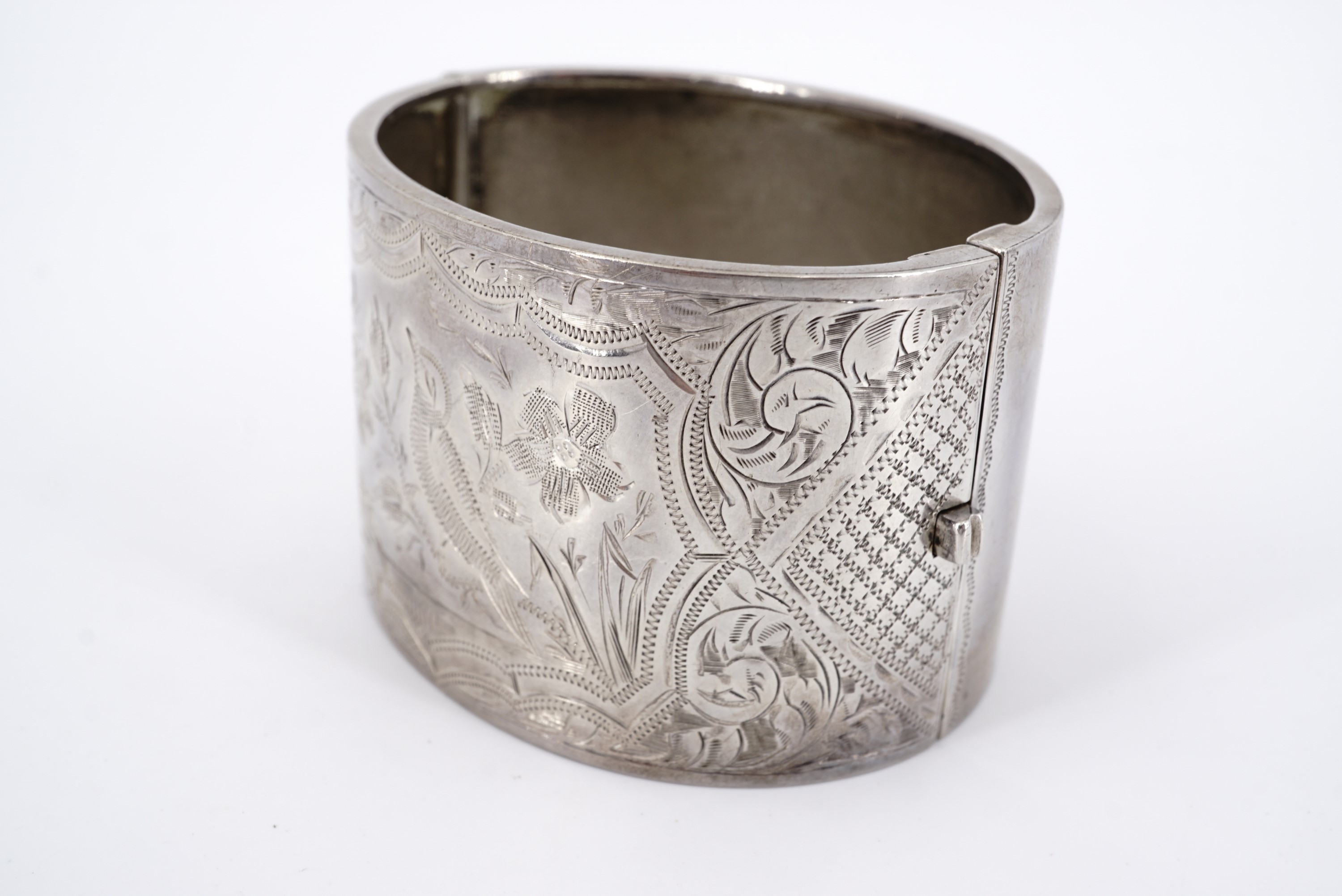 A George V silver hinged cuff bangle, the face wriggle-work and bright-cut engraved with a song bird - Image 2 of 2