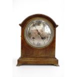 A late 19th / early 20th Century string-inlaid oak mantle clock, having a two-train movement