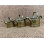 Three brass water carriers