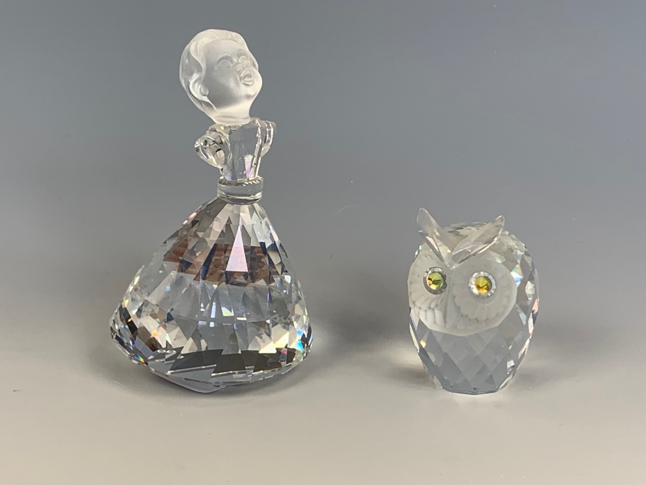 A Swarovski Disney Enchanted Rose cut glass figurine together with a Swarovski owl, former 9 cm