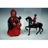 A die-cast lead toy soldier and one other figure, latter 7 cm.